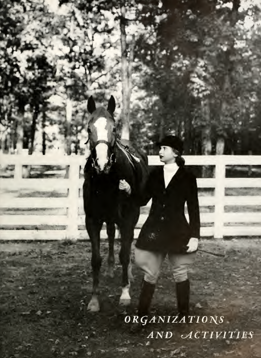 A black and white picture from the 1948 Battlefield with the text "Organizations and Activities" is in the bottom right corner. A woman in riding clothes is standing beside a horse and holding its reigns. They are outside with a fence behind them.